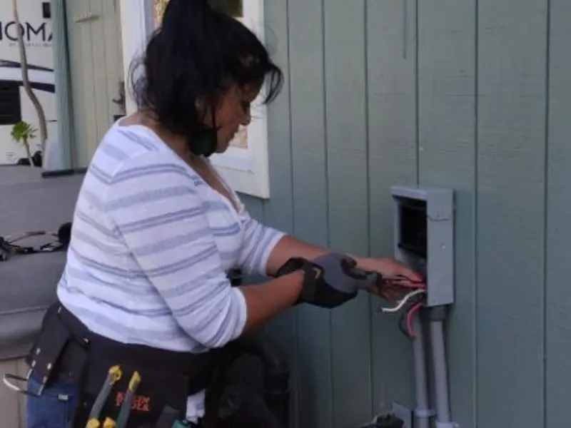 Licensed electrician wiring an exterior subpanel in Boise City