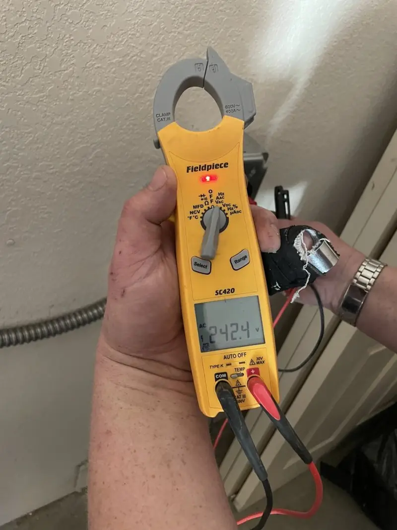 Voltage testing with clamp meter during Electrical Installation Services in Boise City
